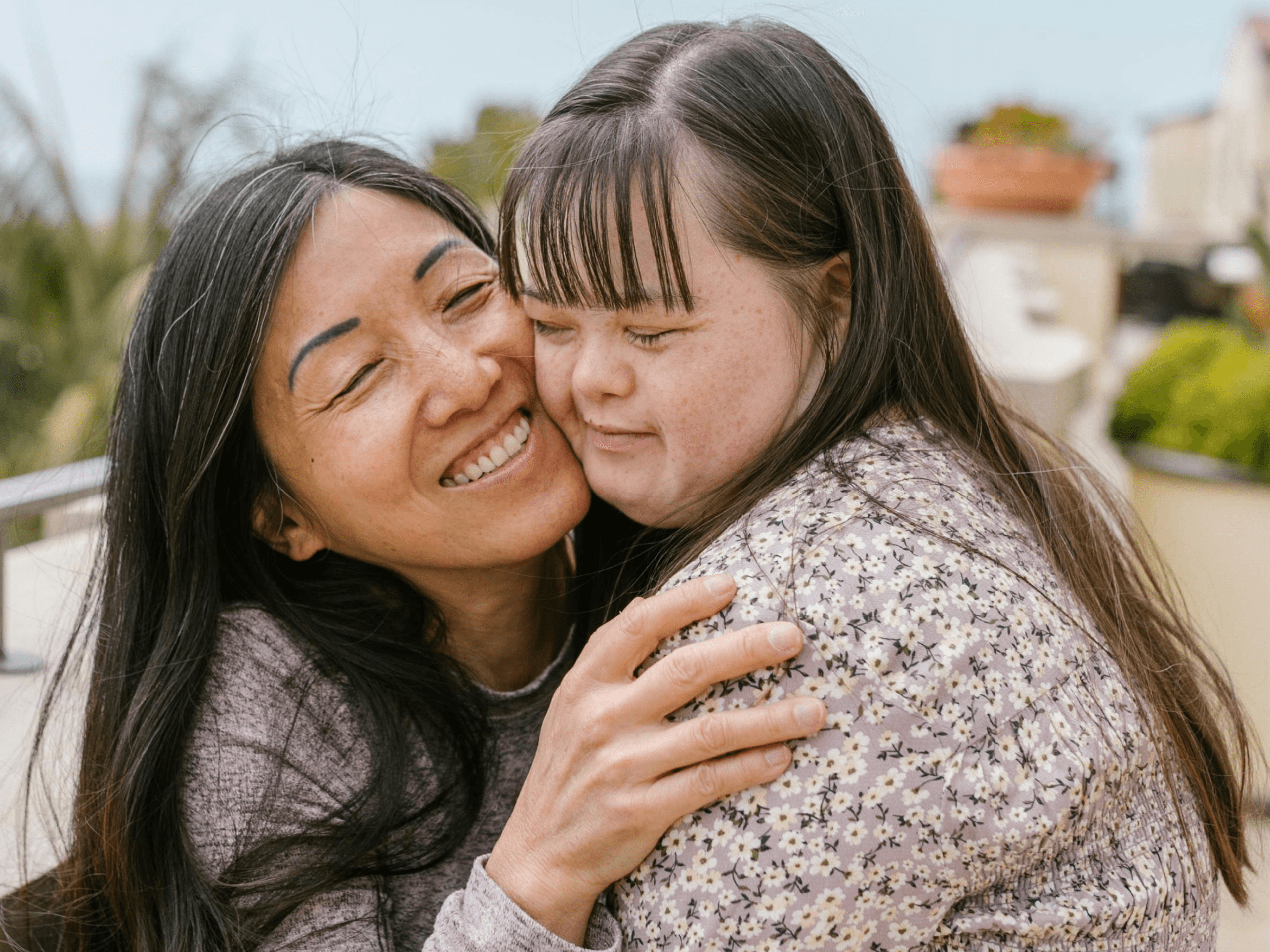 Support worker embracing person with disability showing care and connection